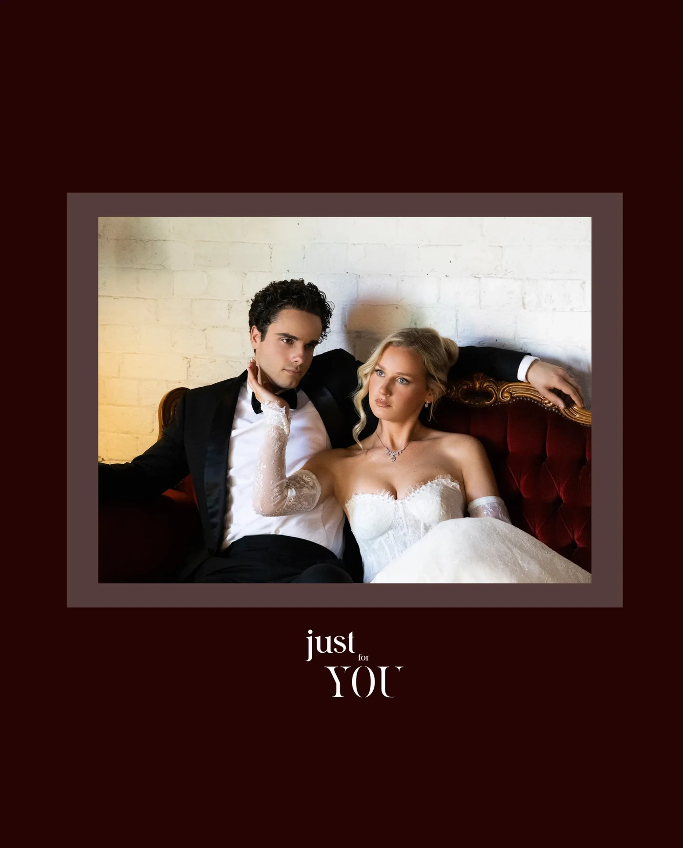 An editorial wedding portrait presented in a burgundy frame.